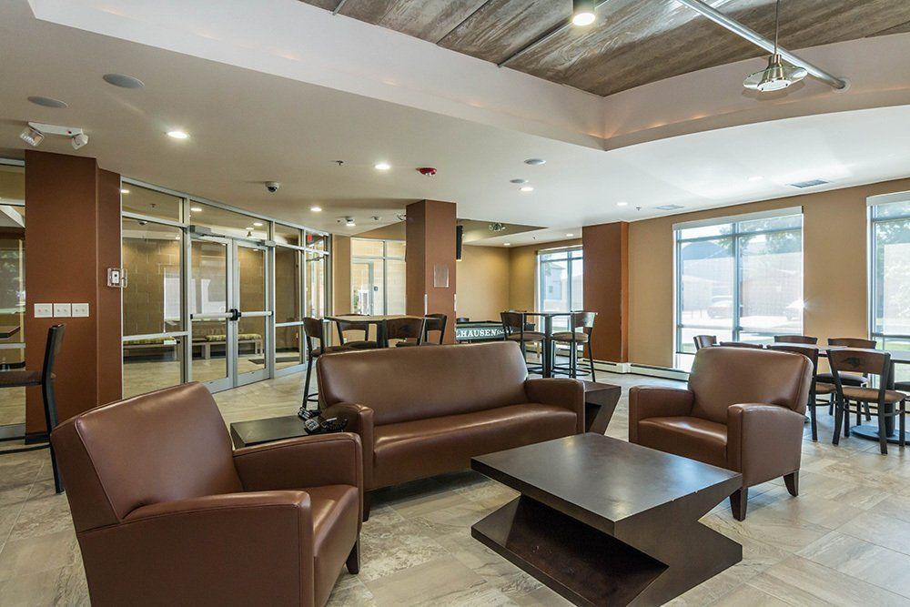 lounge area with brown couches