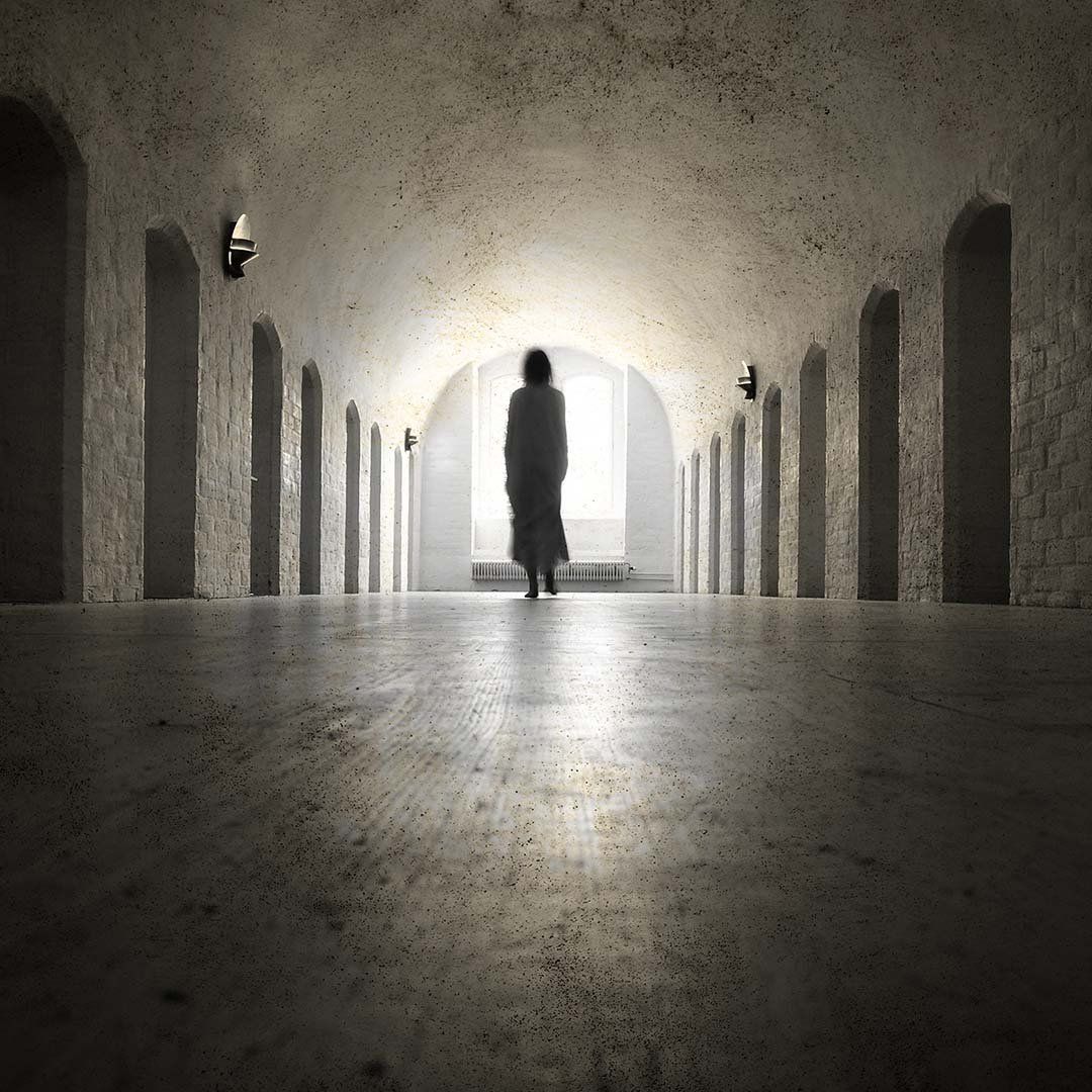 Woman Walking Halls In White