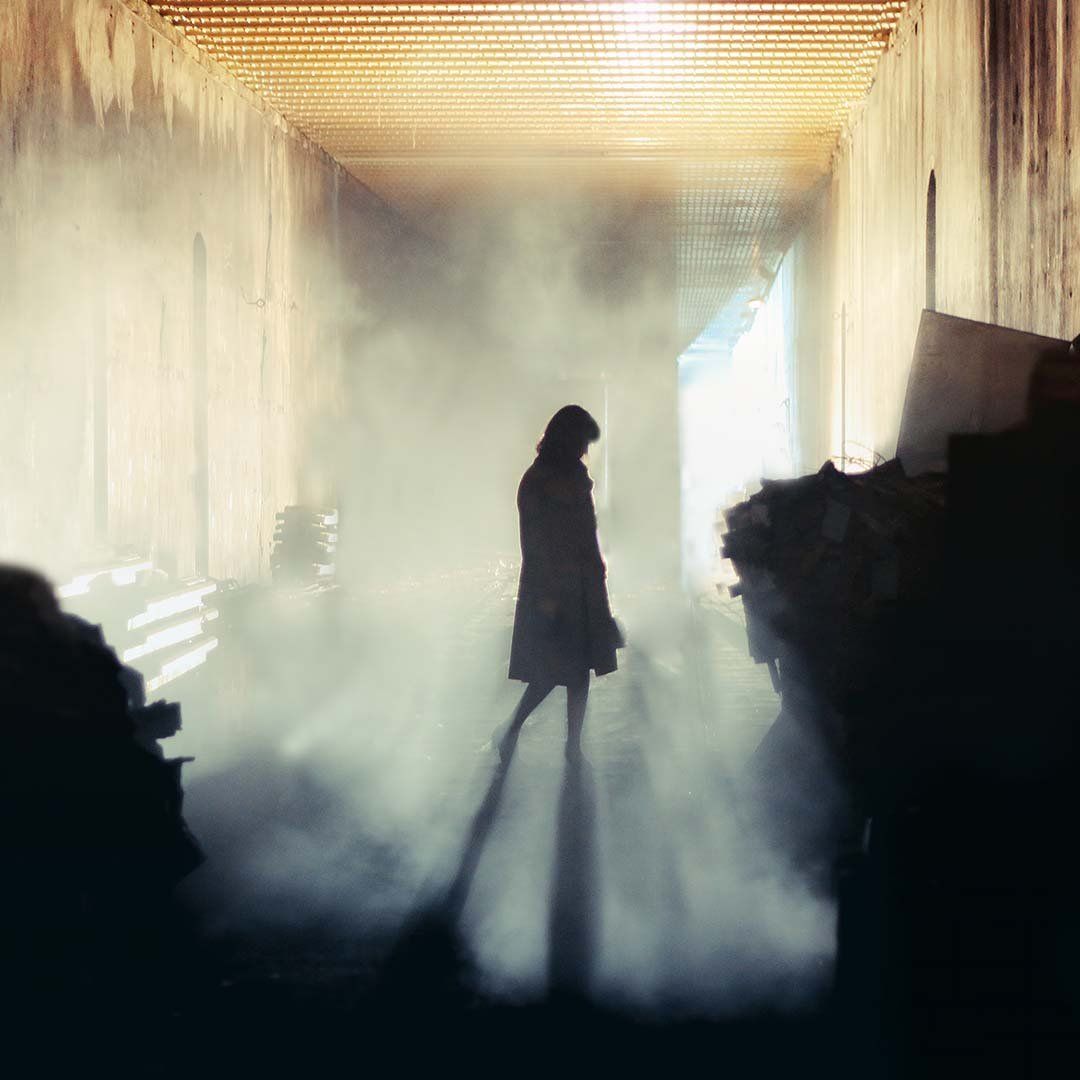 Woman Searching Abandoned Location