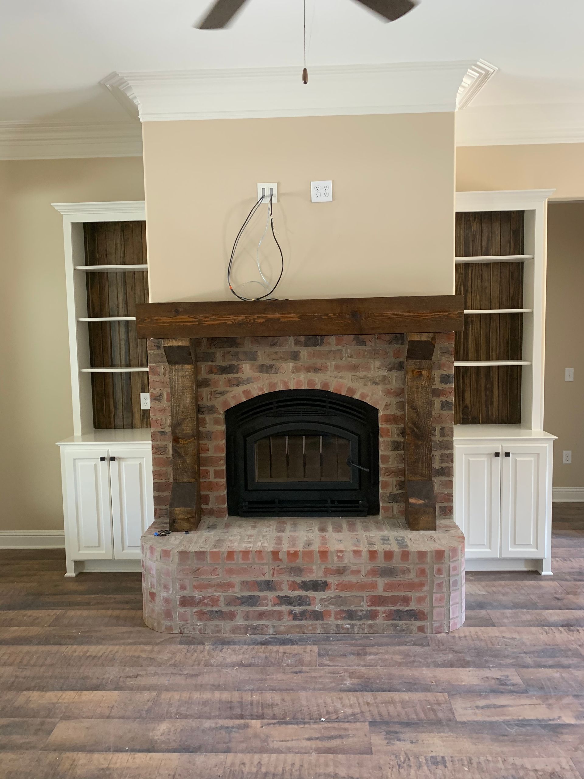 There is a fireplace in the middle of the room.