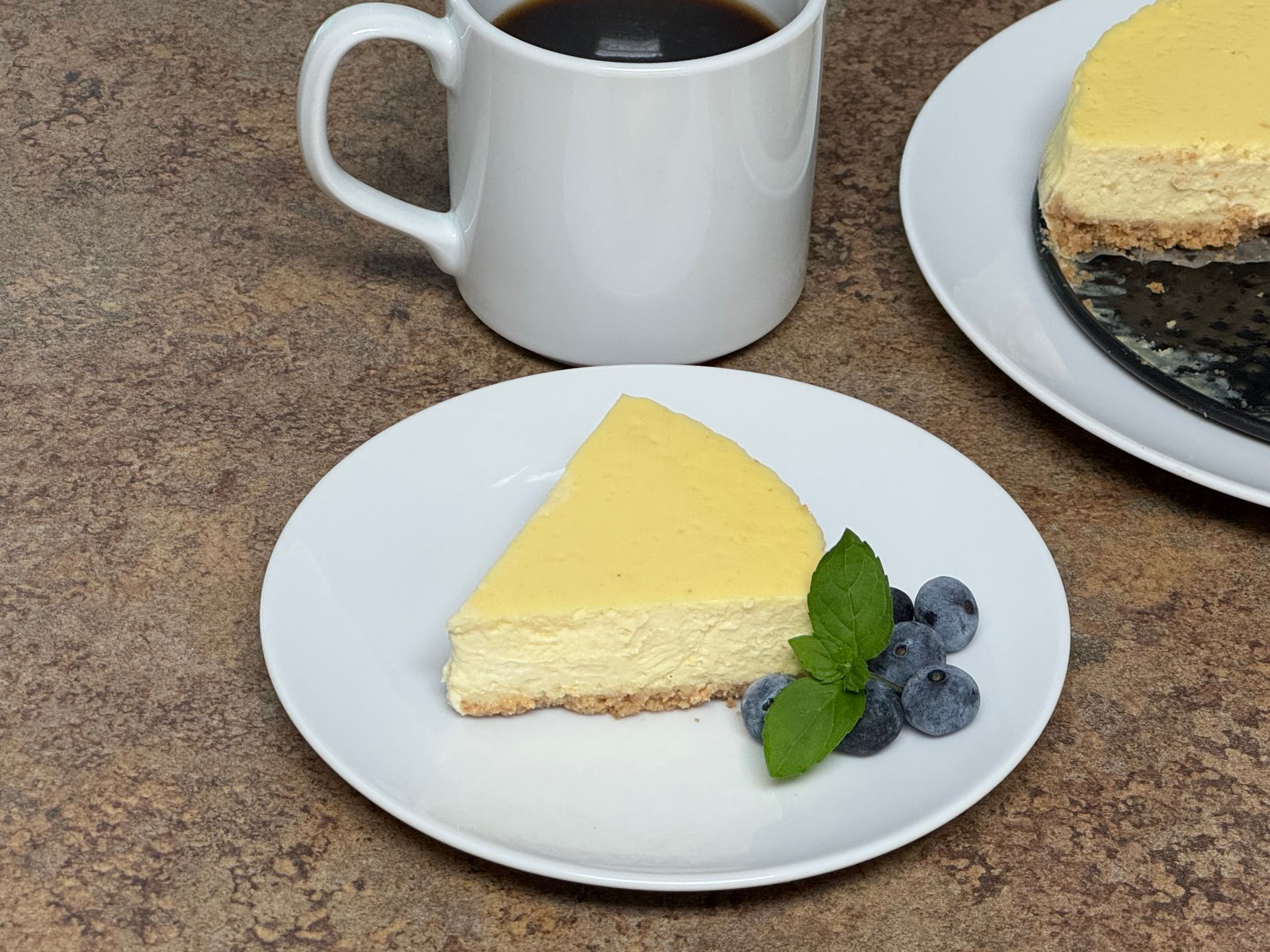 Three desserts are sitting on a table with a measuring cup in the background.