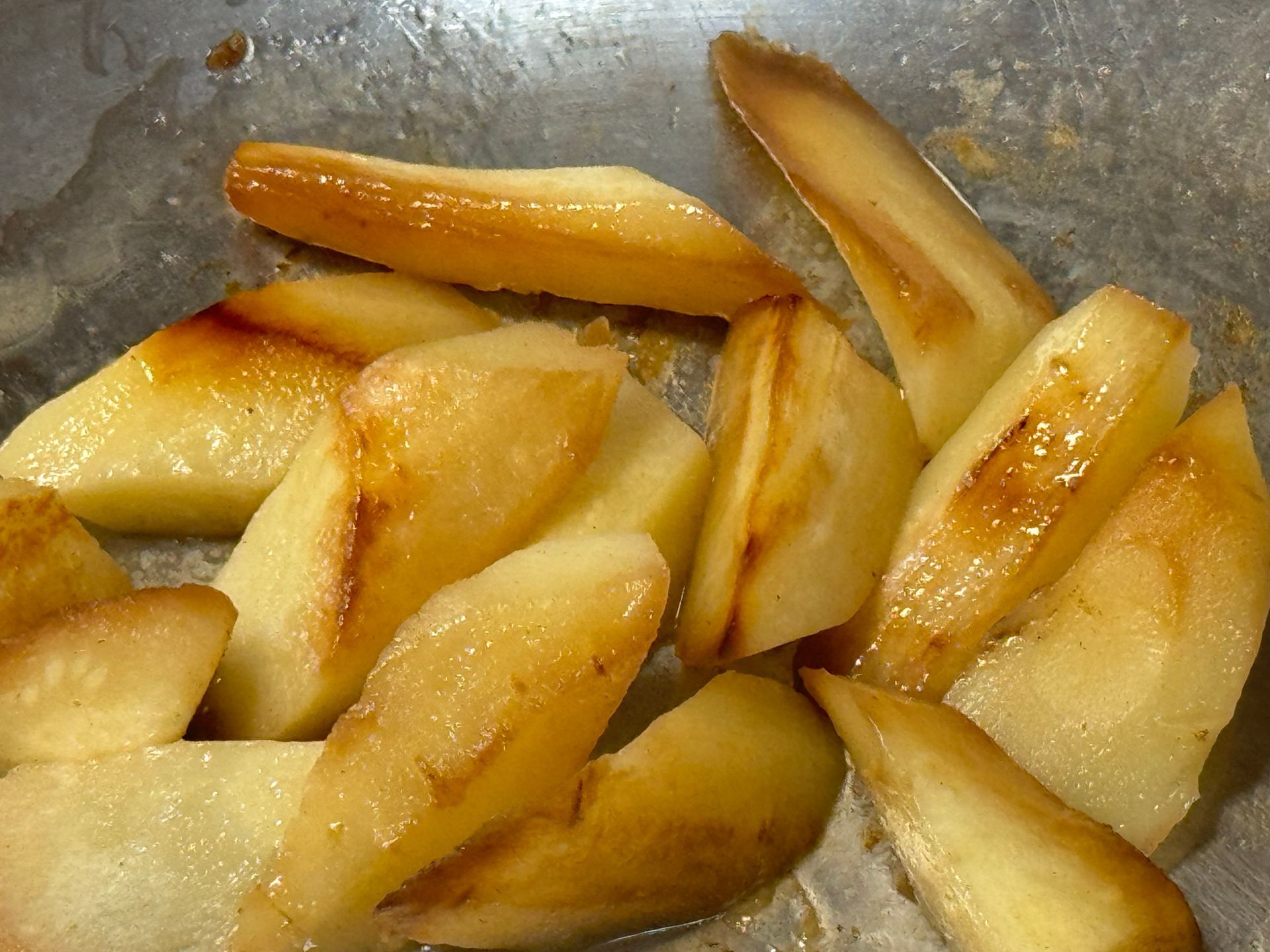 A close up of sliced apples in a pan