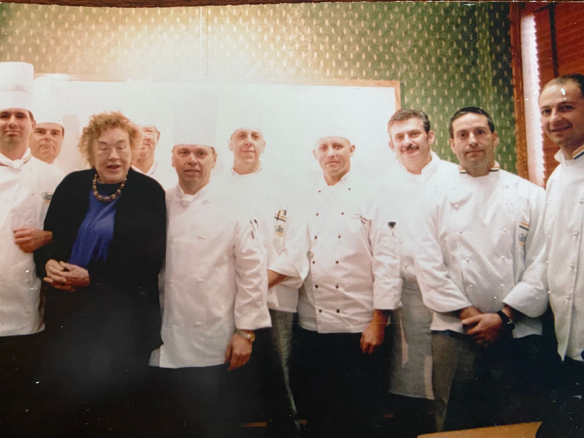 A group of chefs are posing for a picture together