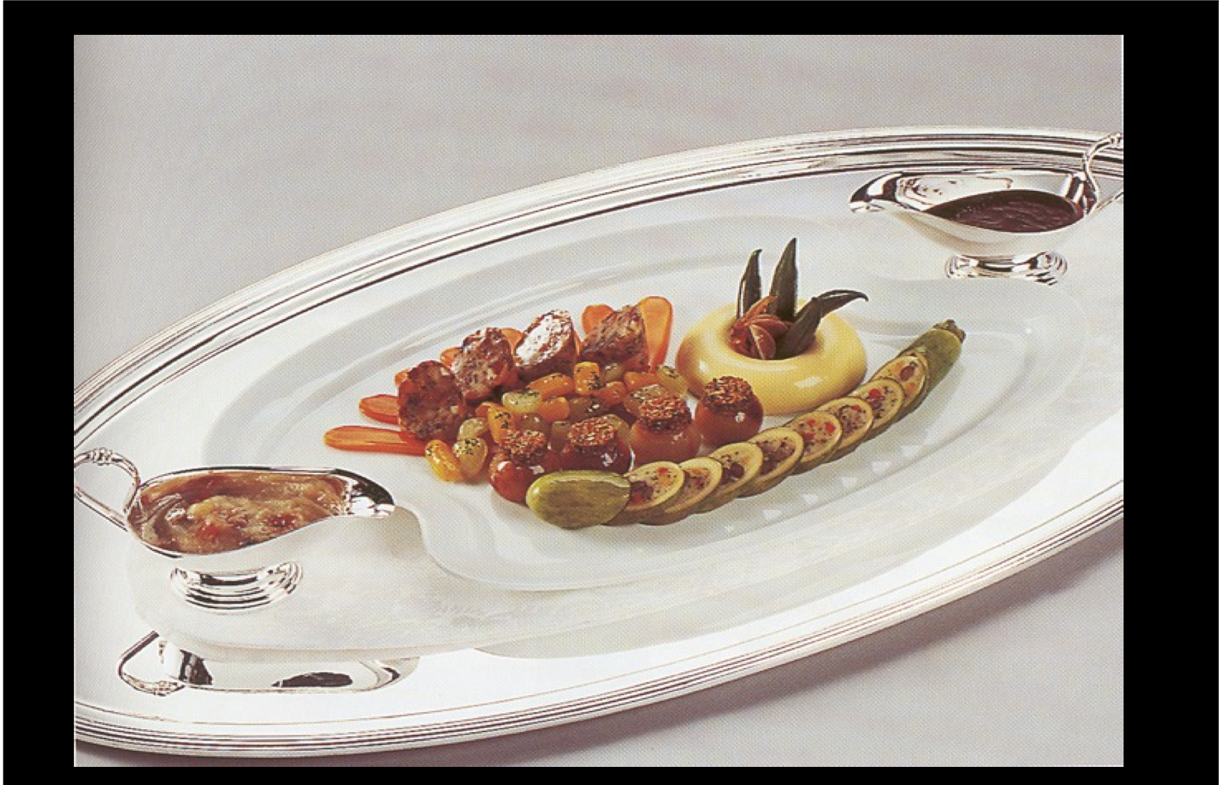 A silver tray with a plate of food on it