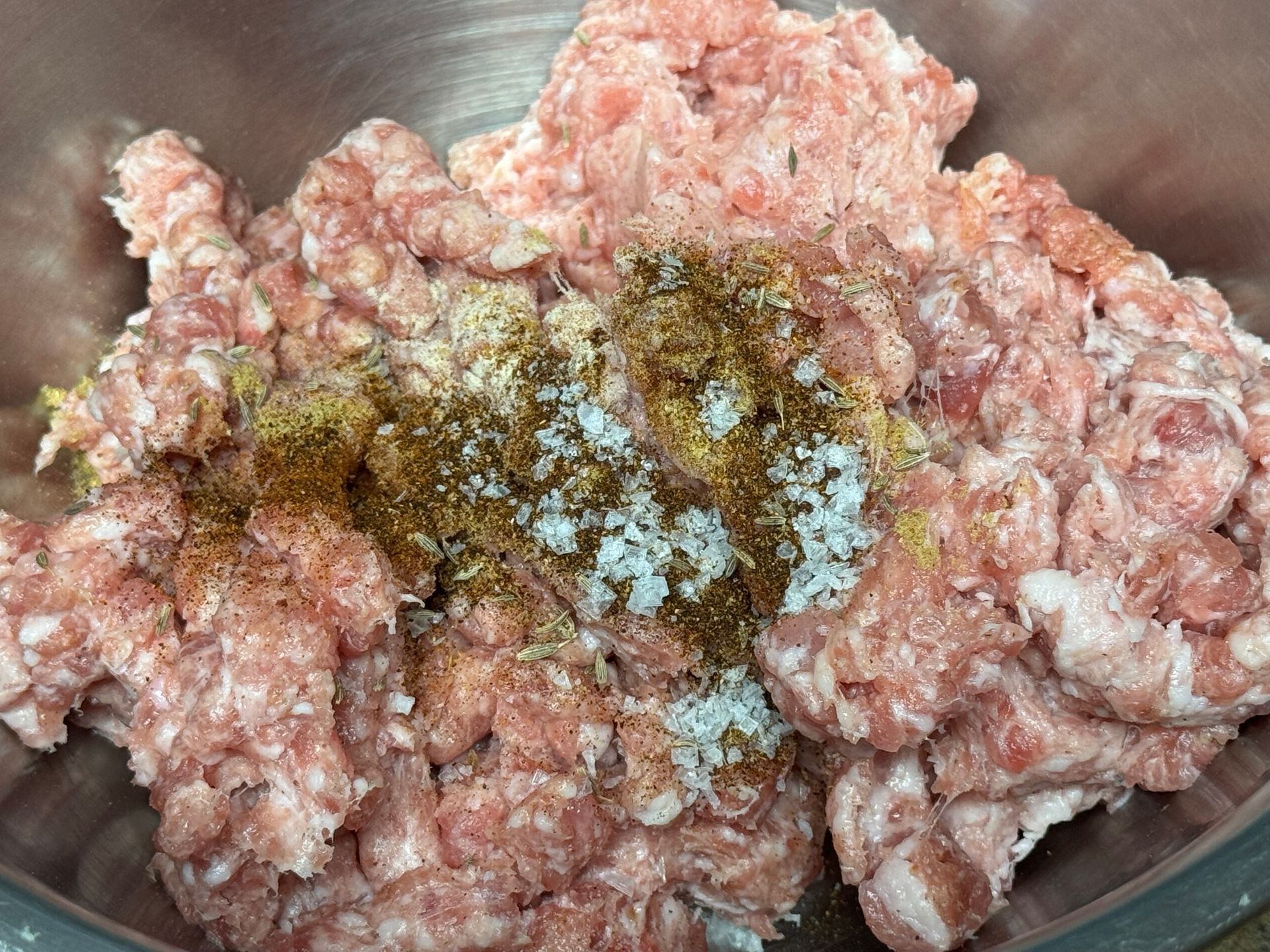 A close up of a bowl of food with a spoon in it.