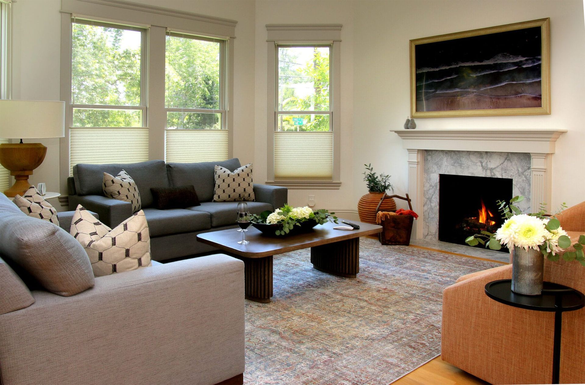 A living room with a fireplace and a couch