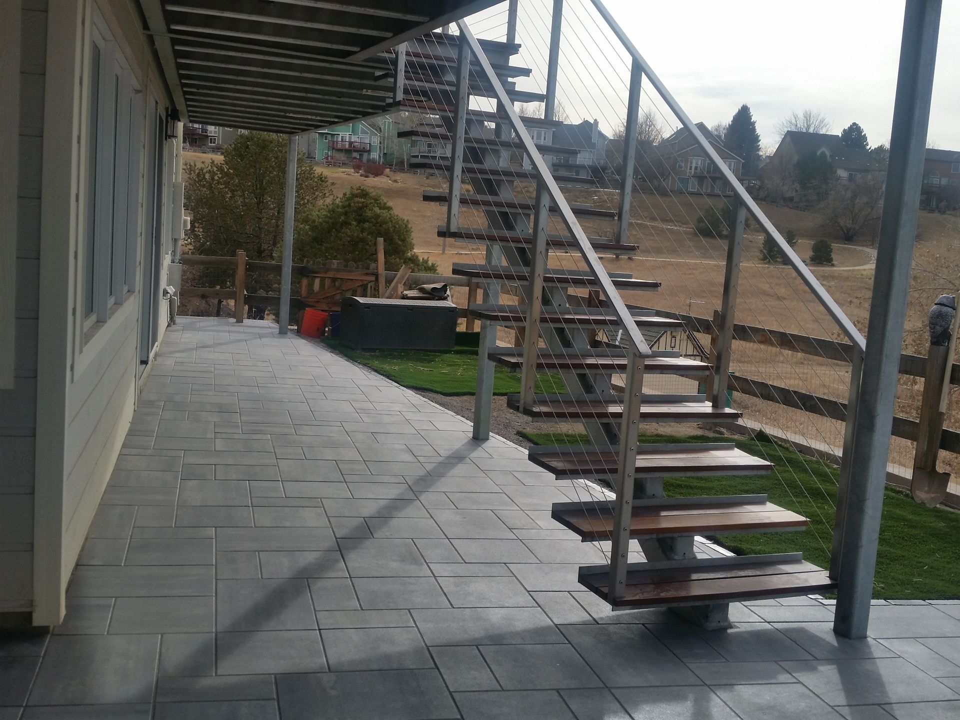 A set of wooden stairs leading up to a house