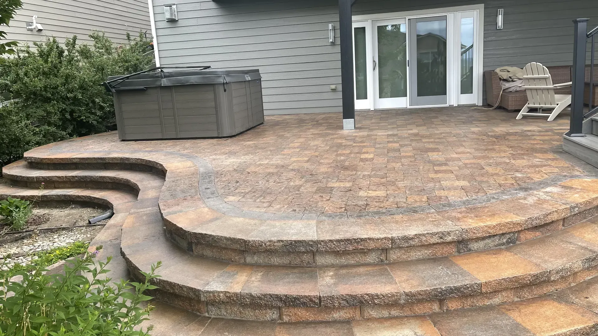 Paver patio with hot tub surround built by Deck Doctor Inc in Centennial CO