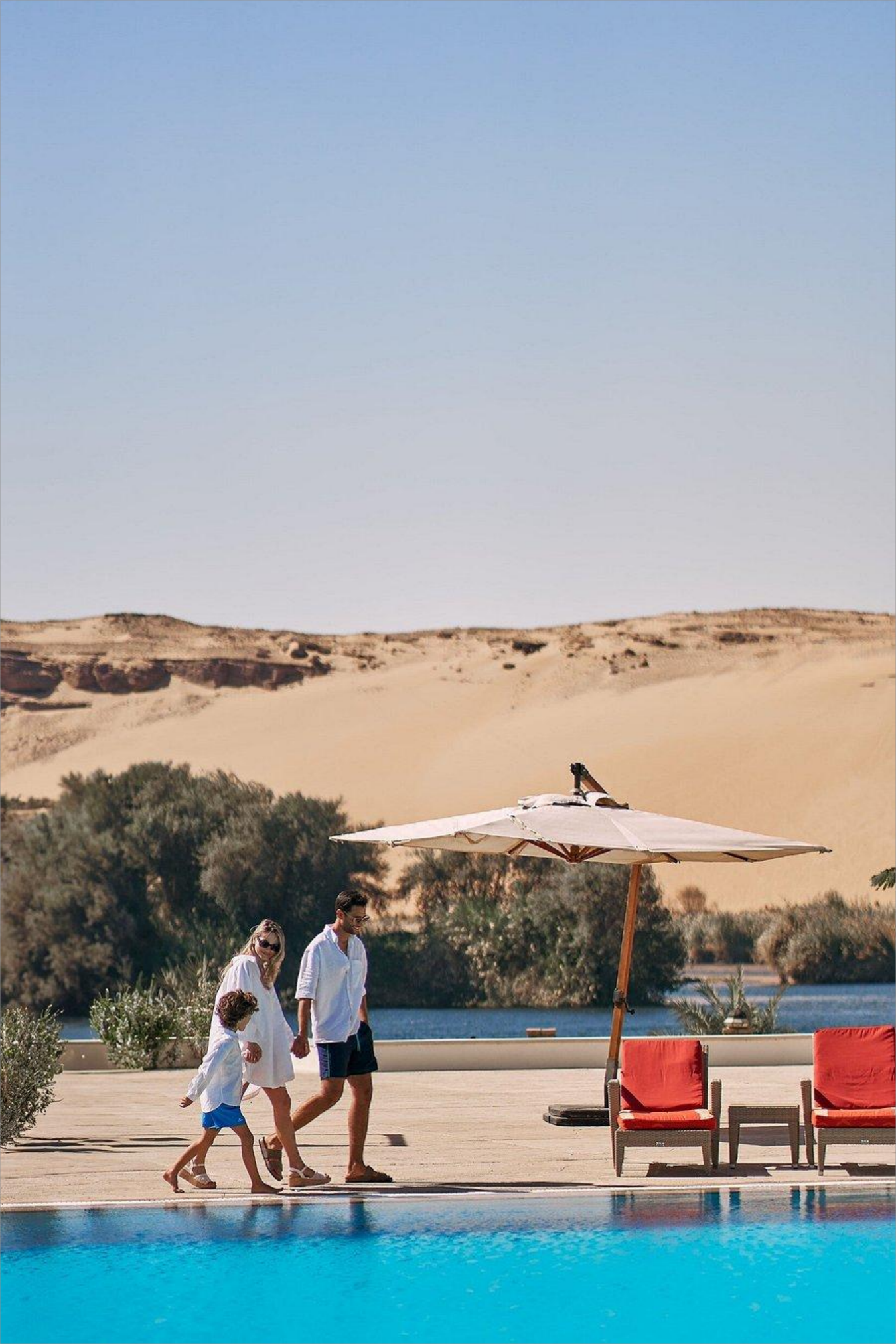 Relaxing vacation experience at a scenic hotel pool with a panoramic view of the Nile in Luxor 