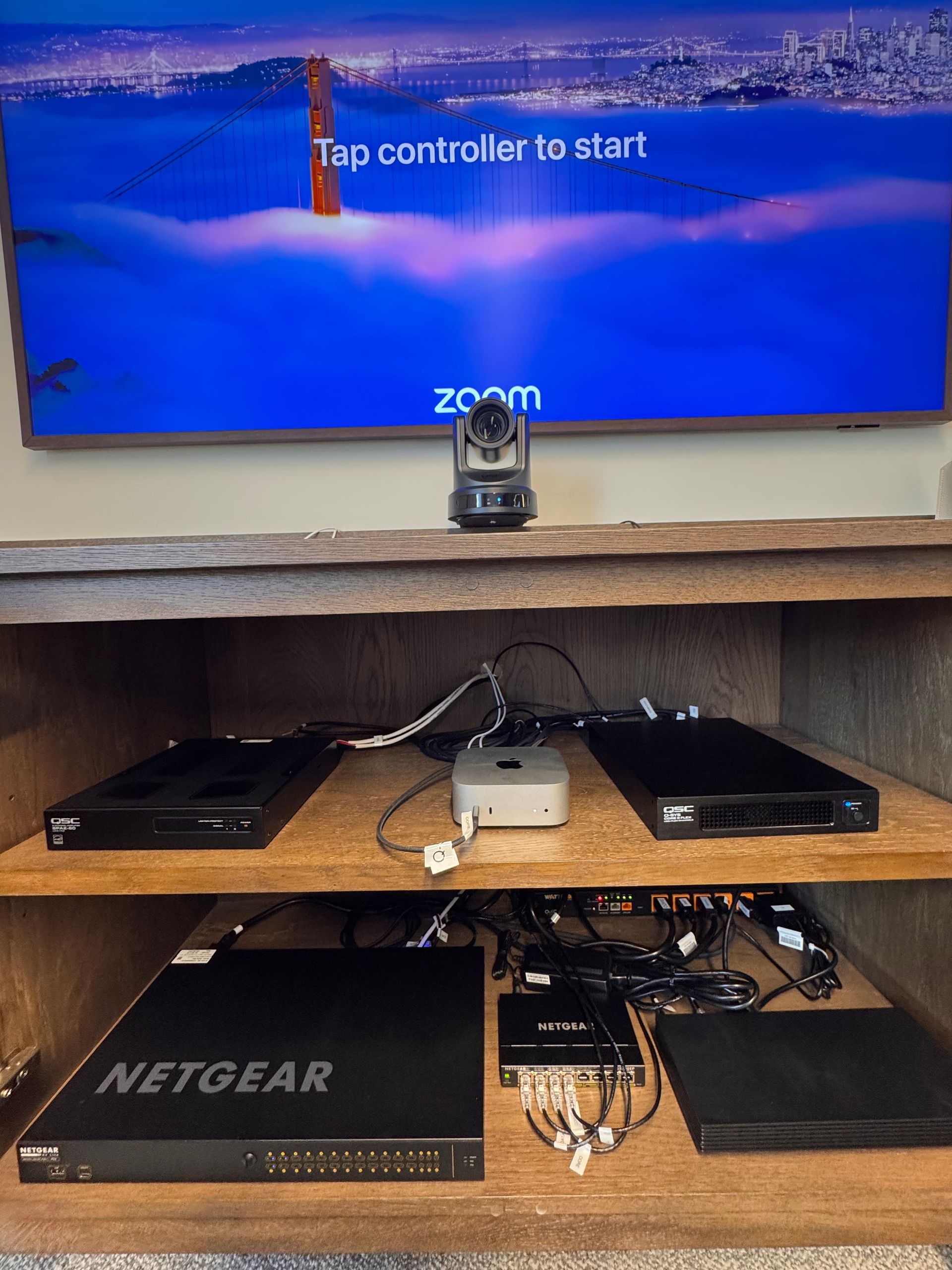 A row of servers are lined up in a dark room