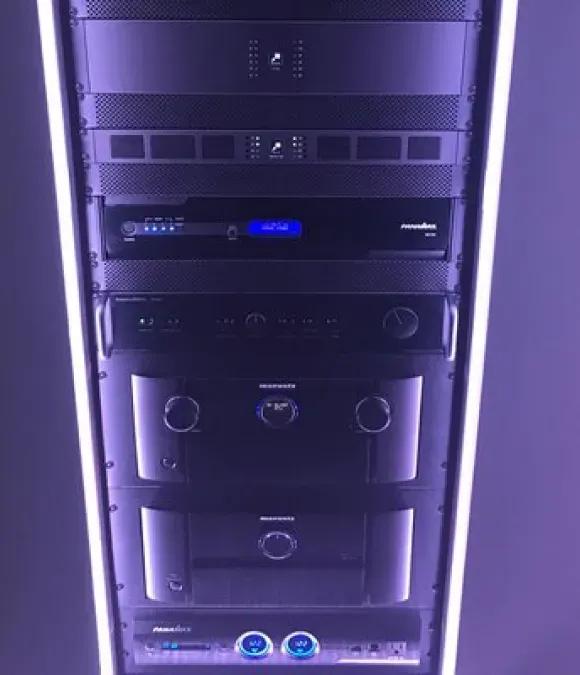A close up of a dj 's mixer in a dark room.