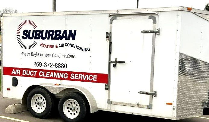 Two Heat Pumps in Winter — Kalamazoo, MI — Suburban Heating & Air Conditioning White trailer with