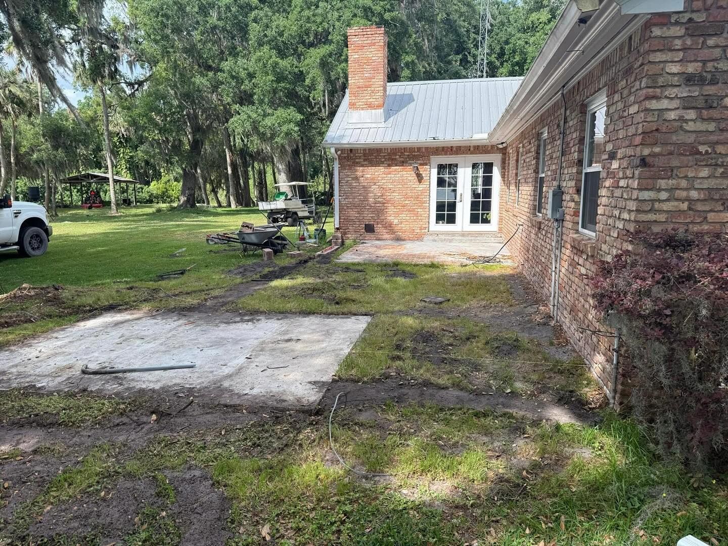 A brick house with a white truck parked in front of it.