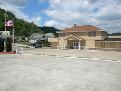 A large building with a parking lot in front of it
