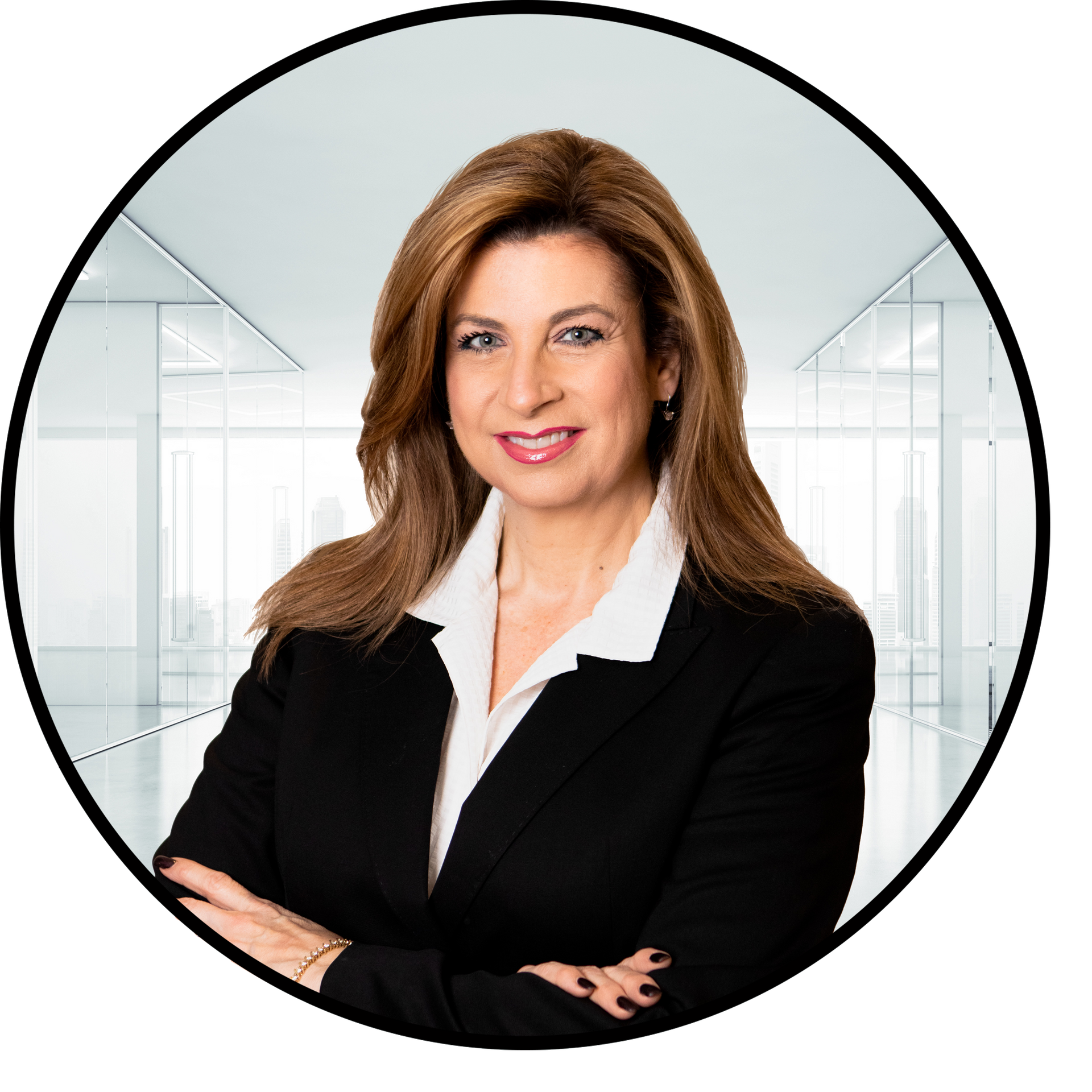 Woman in black suit, white shirt, arms crossed, smiling. Office background.