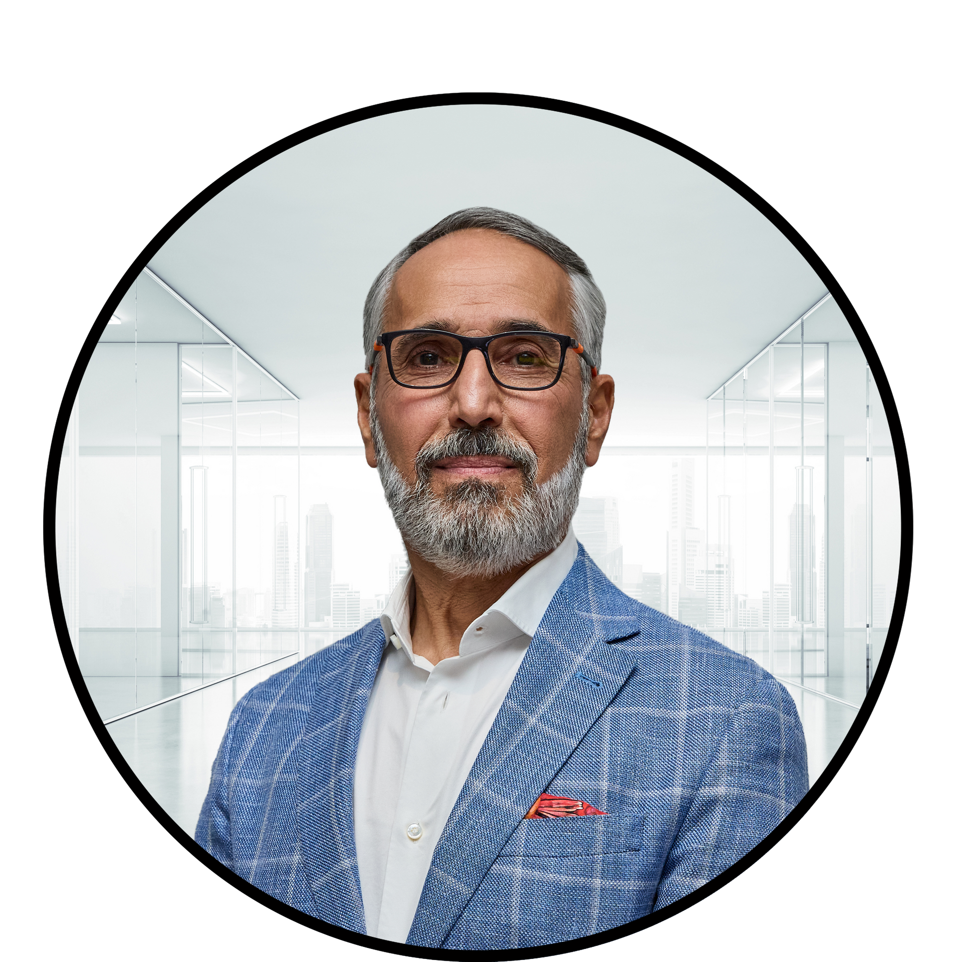 Man in blue blazer, glasses, and open-collared shirt; office background.