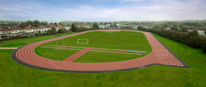 An aerial view of a running track in a field.