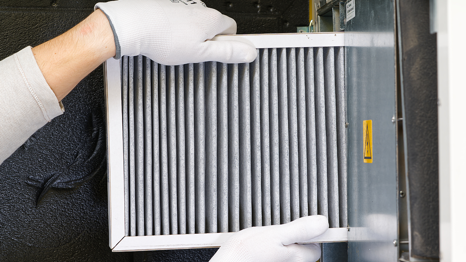 Air filter being replaced in HVAC system