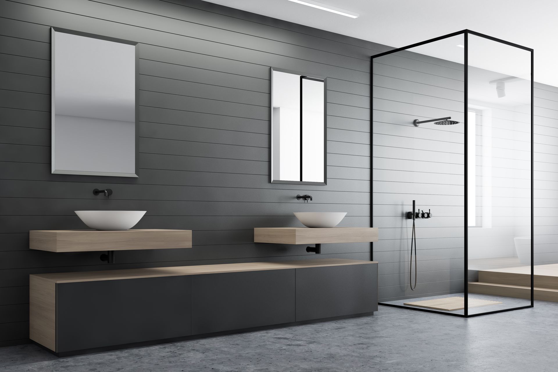 Modern minimalist bathroom with double sinks, gray walls, mirrors, and a glass-enclosed shower