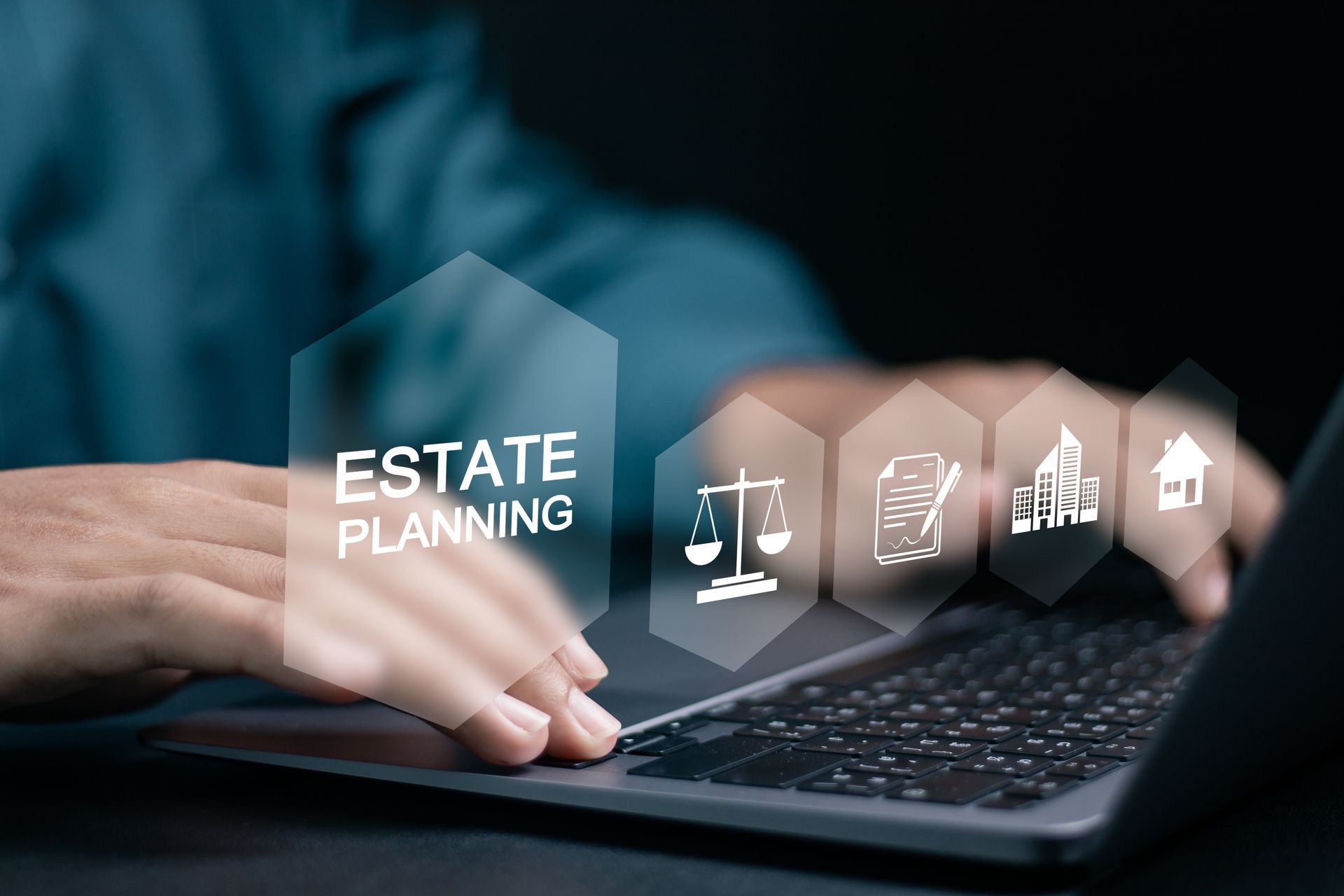 Hands typing on laptop with “Estate Planning” and legal icons overlay on dark background