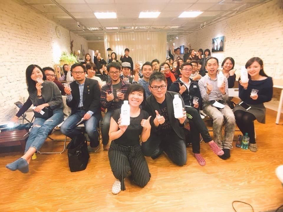 A group of people are posing for a picture in a room.