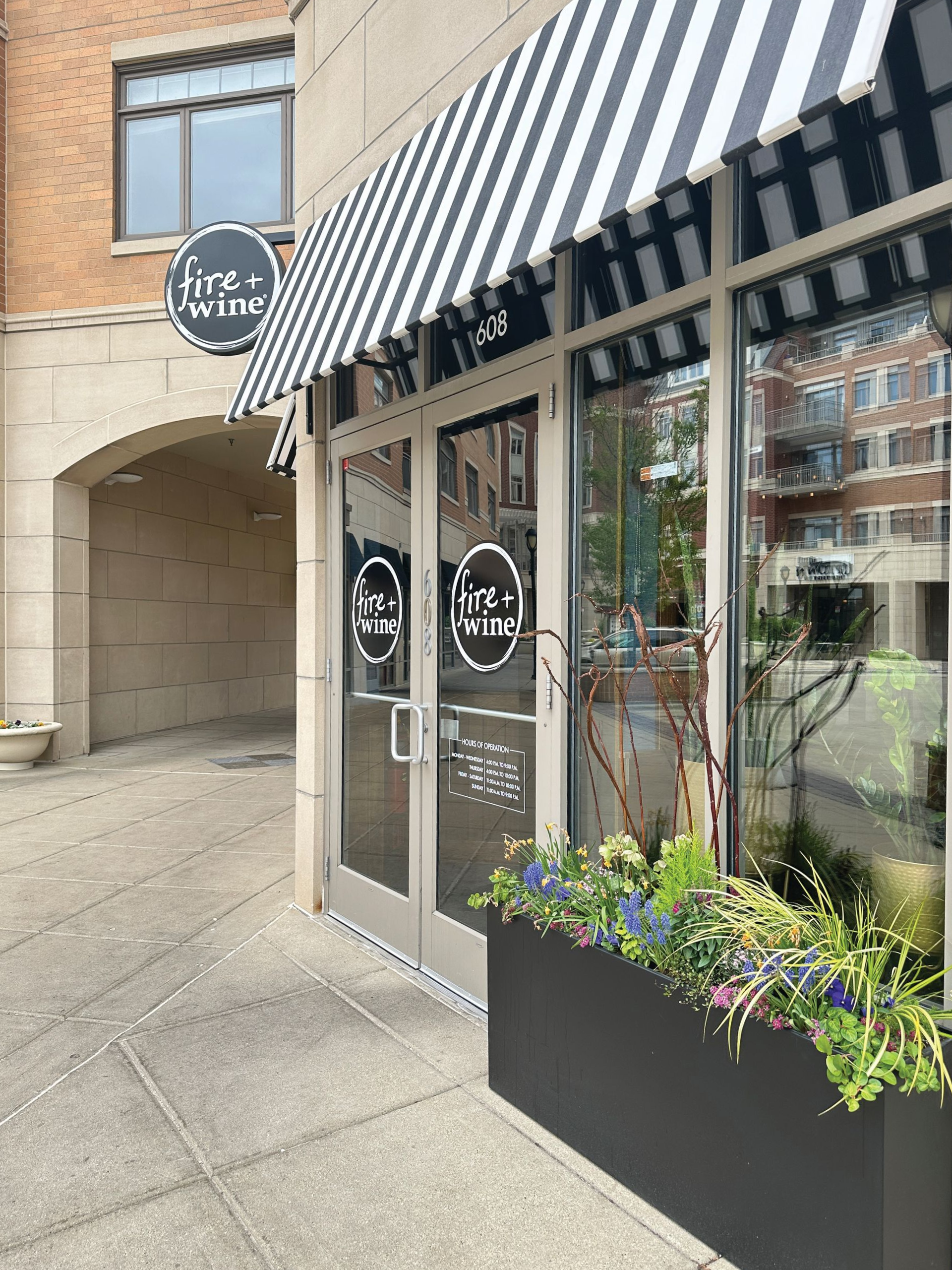 Exterior Blade Sign and window vinyl for fire+wine restaurant storefront led illuminated