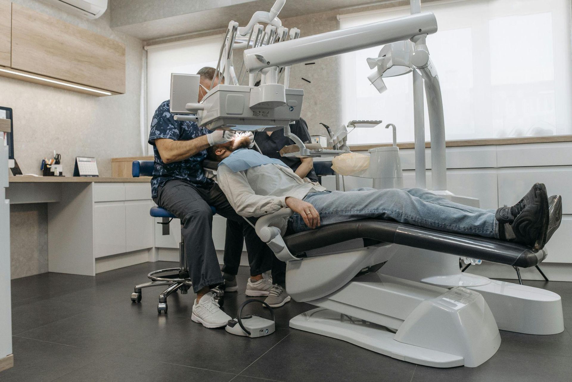 a dentist examining a patient’s teeth