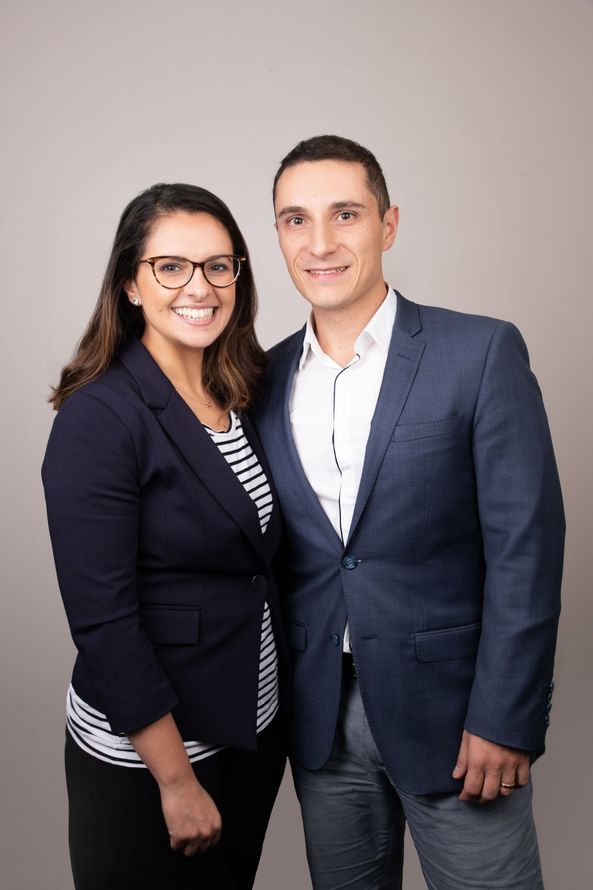 A man and a woman are posing for a picture together.