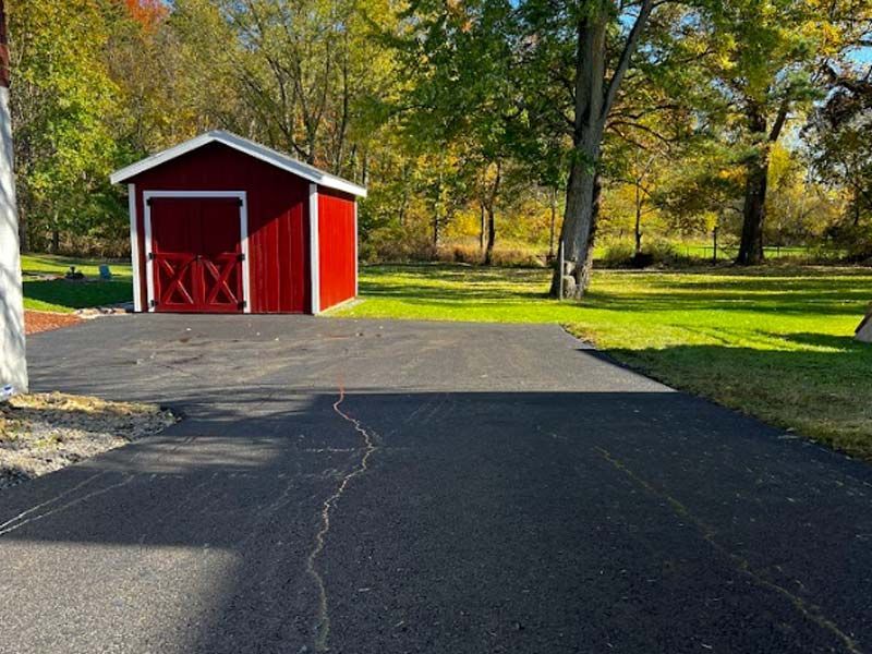 Newly paved asphalt driveway.