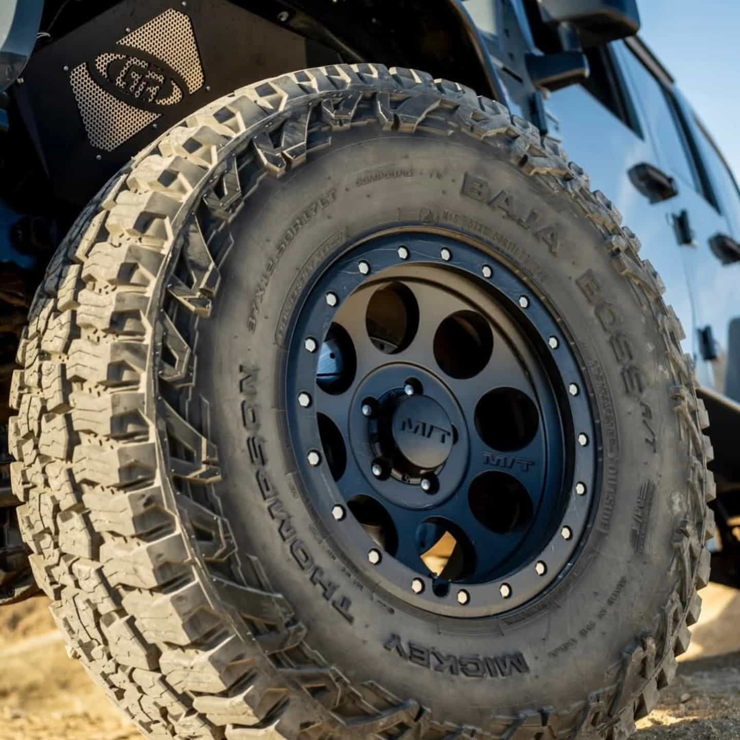 Black off-road Tyre and Wheel on a Jeep, With Visible Tread and Wheel Details — Plateau Tyres in Lennox Head, NSW