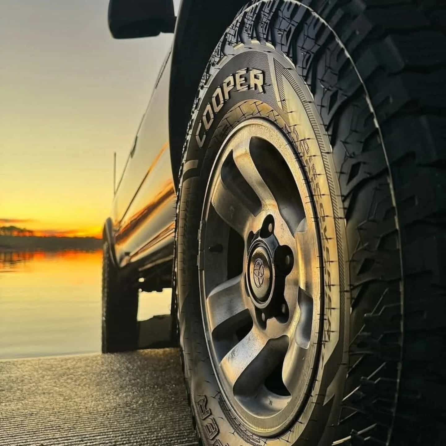 Black Truck Wheel With Cooper Tyre on a Ramp at Sunset — Plateau Tyres in Ballina, NSW