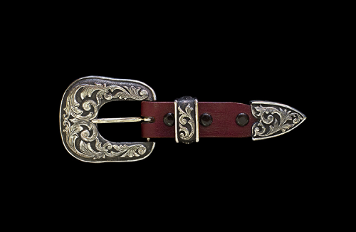 Silver engraved buckle set on a maroon leather strap.