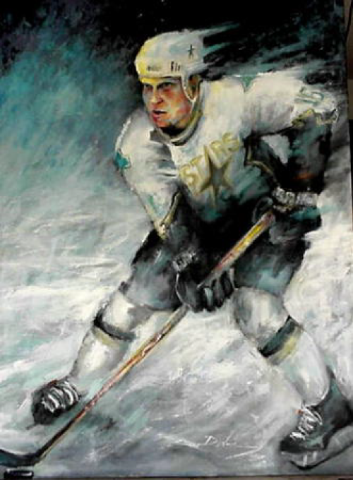 Hockey player in a white and green Stars jersey, skating with puck on ice, viewed from below.