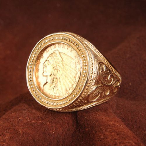 Gold ring with an Indian Head gold coin, ornate details.