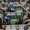 A close up of a bunch of electronic components with the word t on one of them