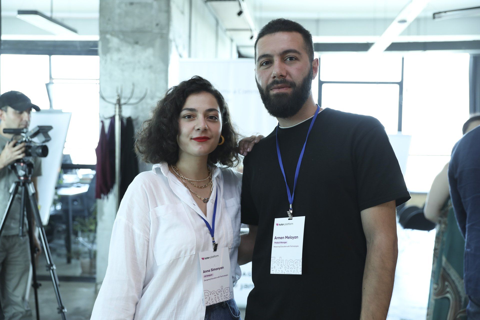 A man and a woman are posing for a picture in a room.
