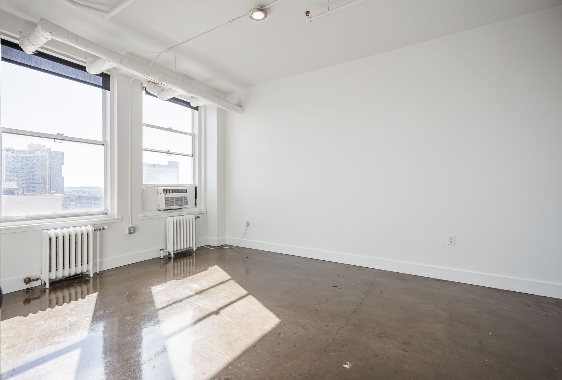 Bedroom with two large windows
