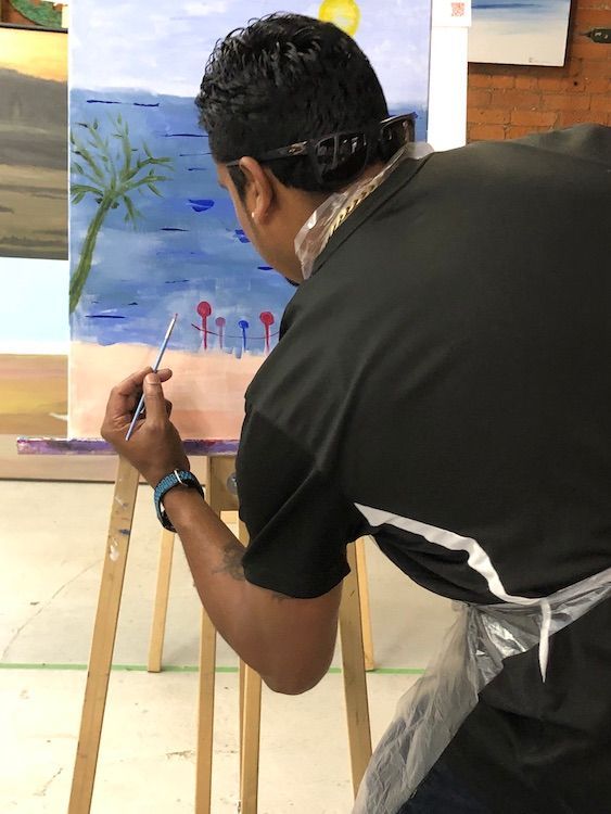 Photo of student at studio k2 abstract paint night.