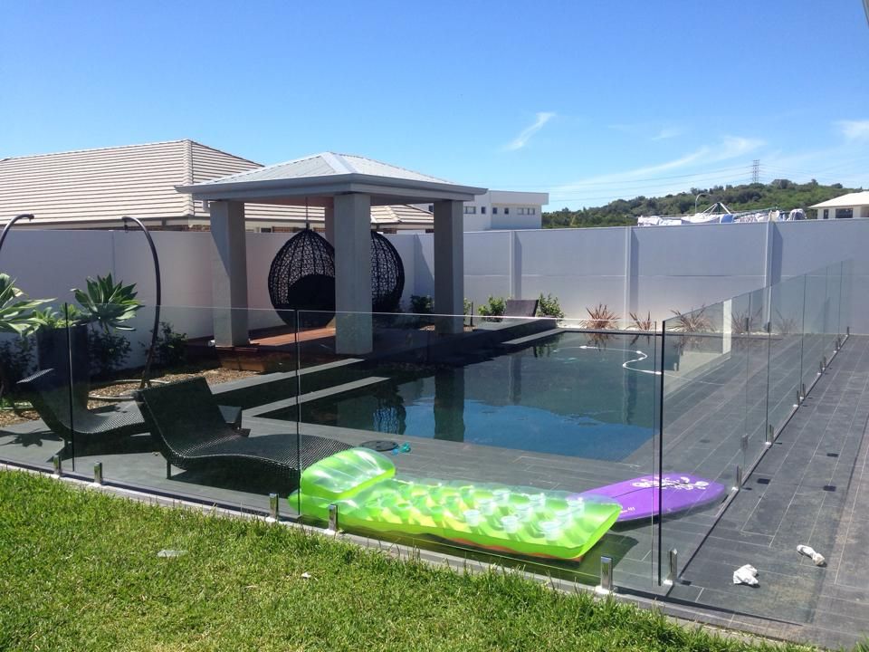 A Backyard Swimming Pool With a Gazebo — ClearView Glass Pool Fencing In Roselands, NSW