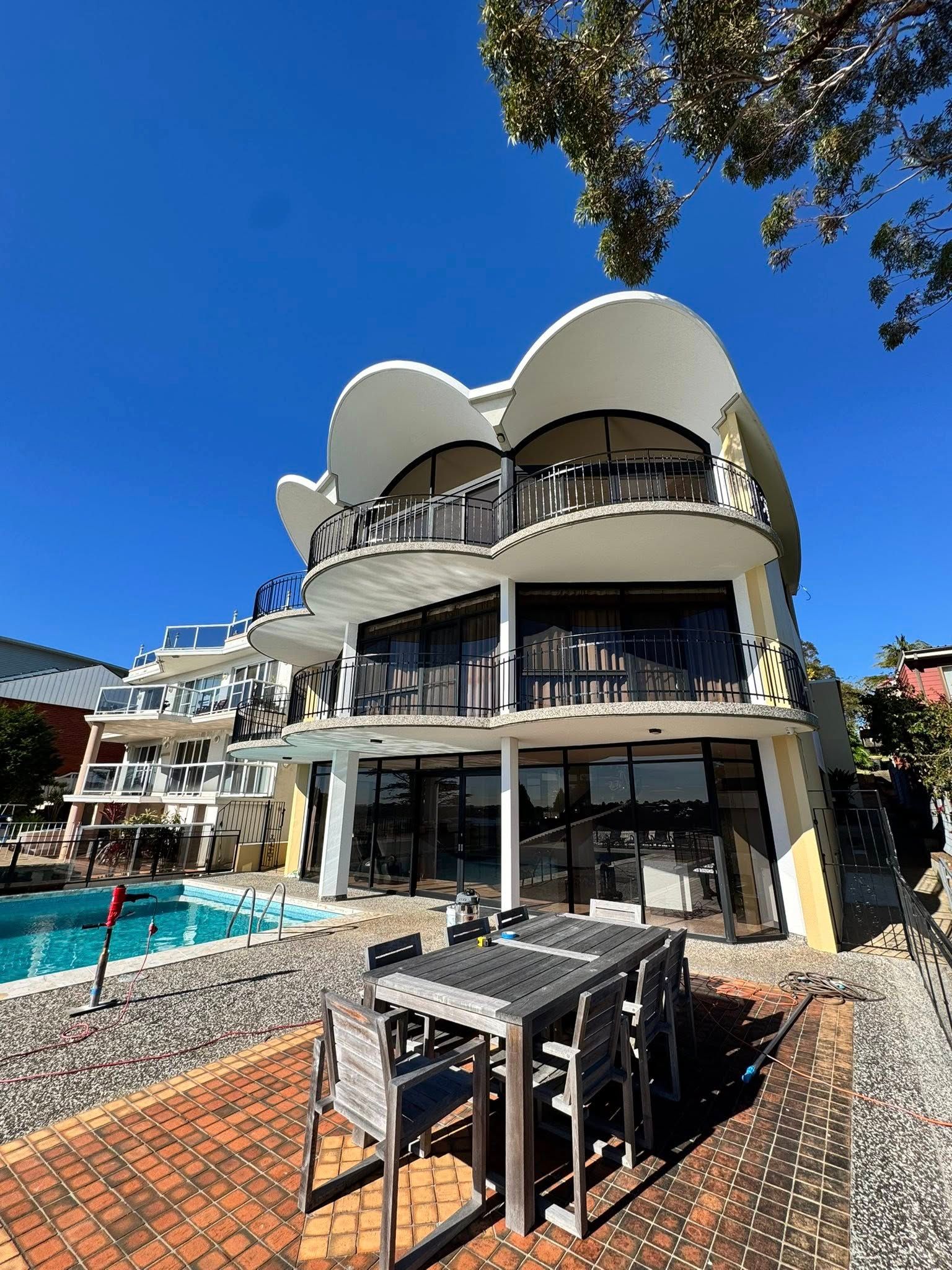 A Modern House With Swimming Pool — ClearView Glass Pool Fencing In Roselands, NSW