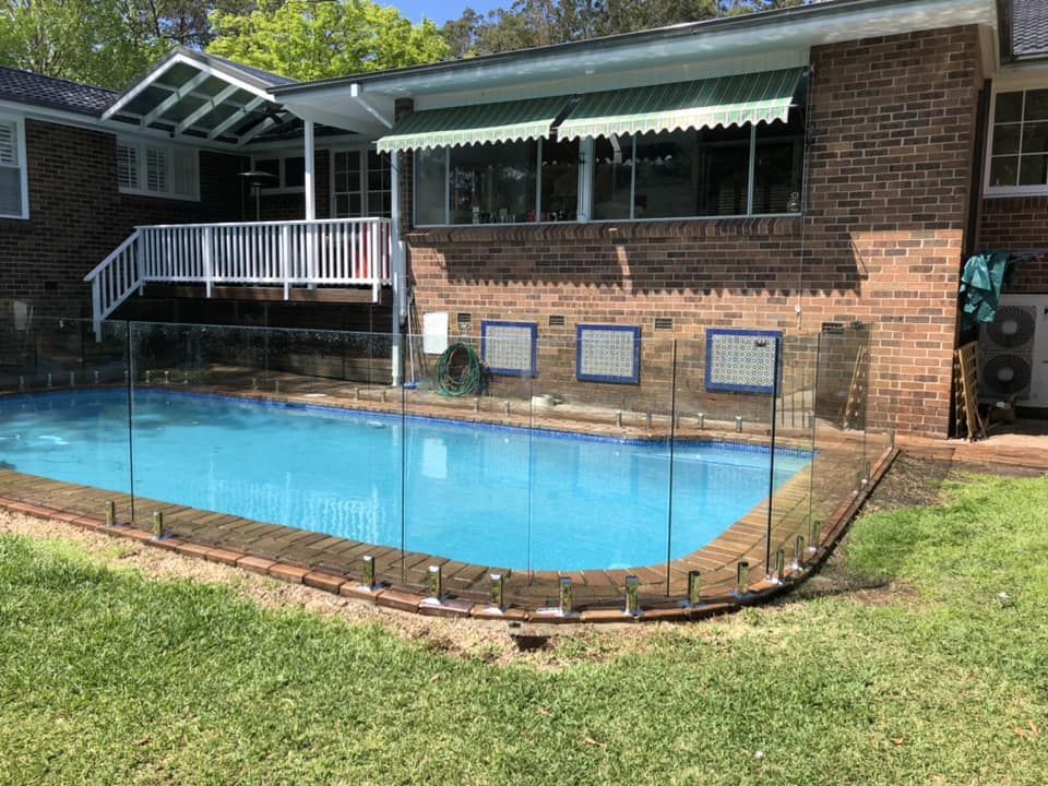A Backyard Swimming Pool and Clear Glass Fencing — ClearView Glass Pool Fencing In Parramatta, NSW