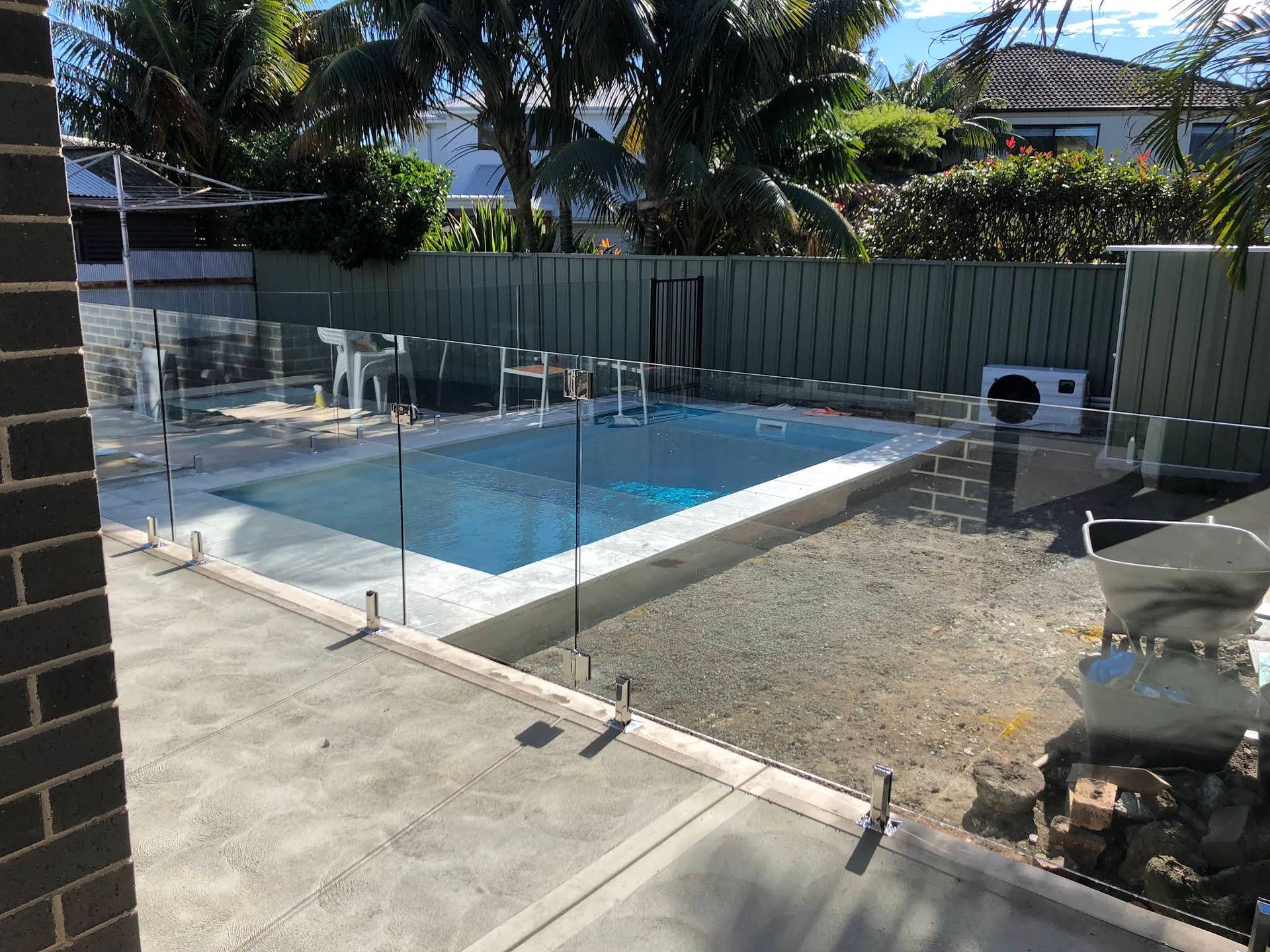 Backyard Swimming Pool Enclosed by Clear Safety Fencing — ClearView Glass Pool Fencing In Eastern Suburbs, NSW