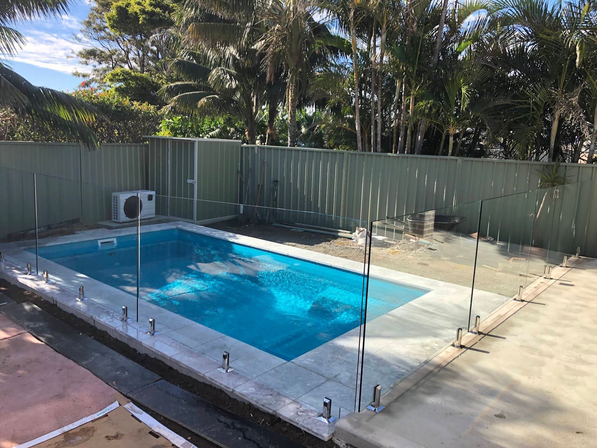 Backyard Swimming Pool Enclosed by Clear Glass Fencing — ClearView Glass Pool Fencing In Eastern Suburbs, NSW