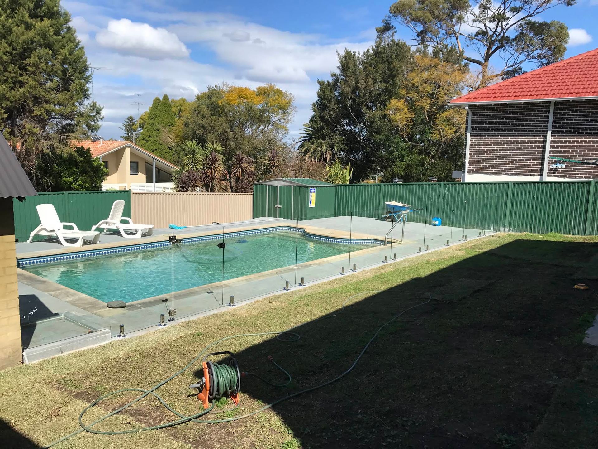 Backyard With a Covered Swimming Pool — ClearView Glass Pool Fencing In Parramatta, NSW