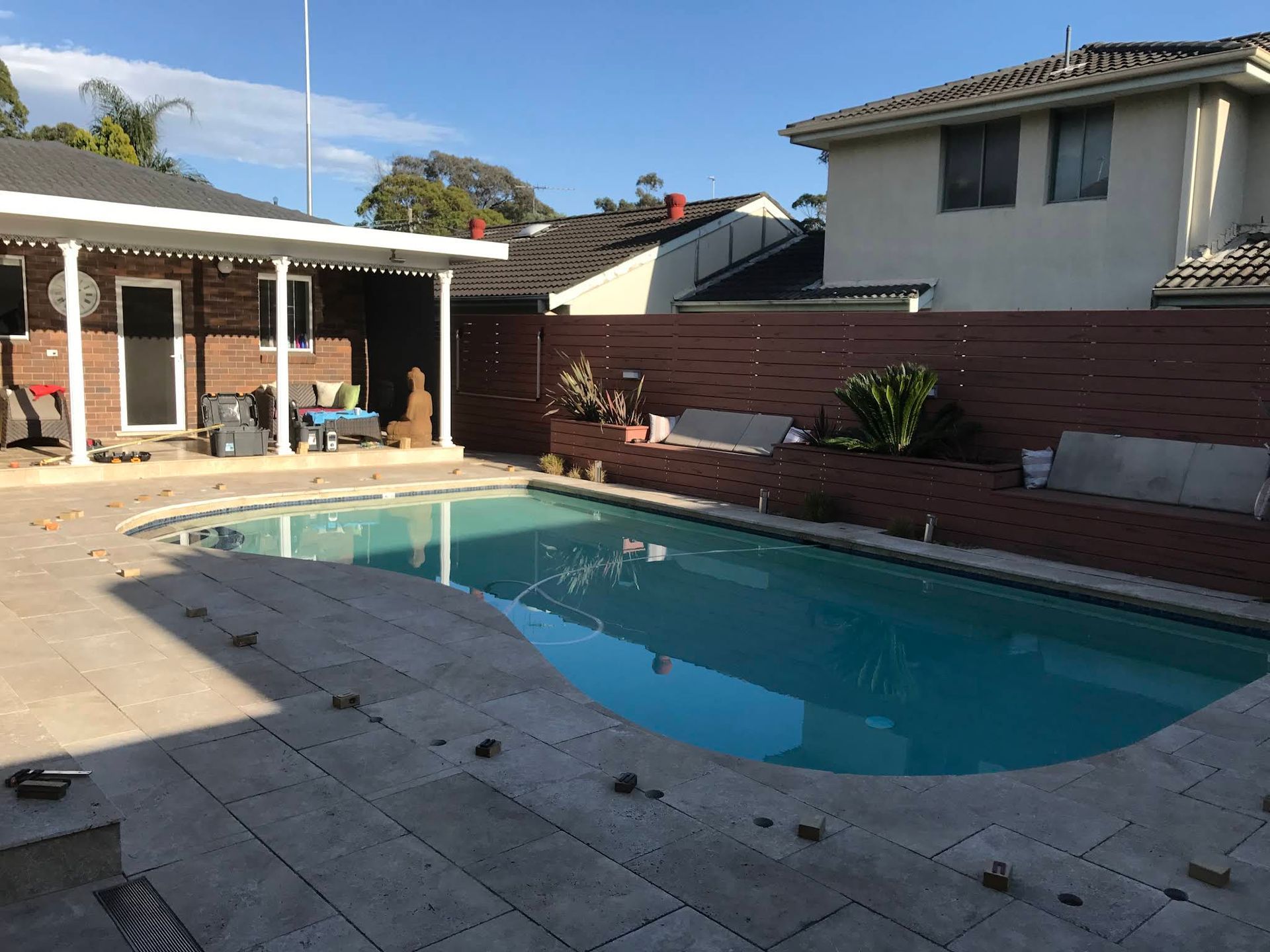 Backyard Swimming Pool With Covered Patio Area — ClearView Glass Pool Fencing In Northern Beaches, NSW