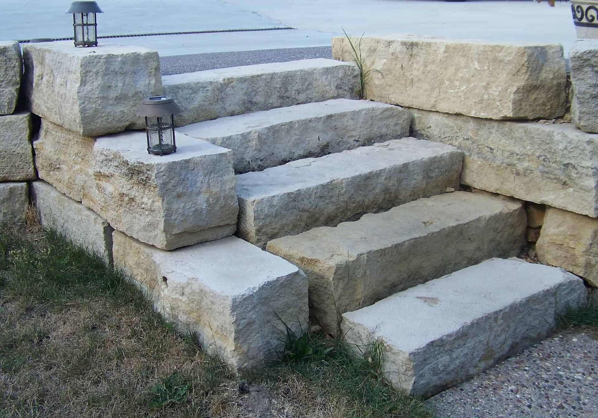 A set of stone stairs with a light on top of them