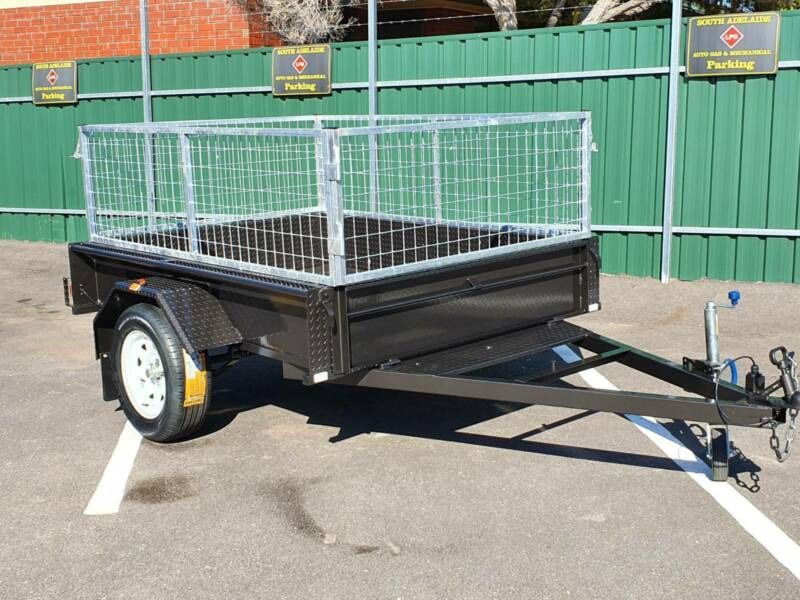 Black Cage Trailer Against a Scenic Landscape — Voyager Trailers in Yarrawonga, NT
