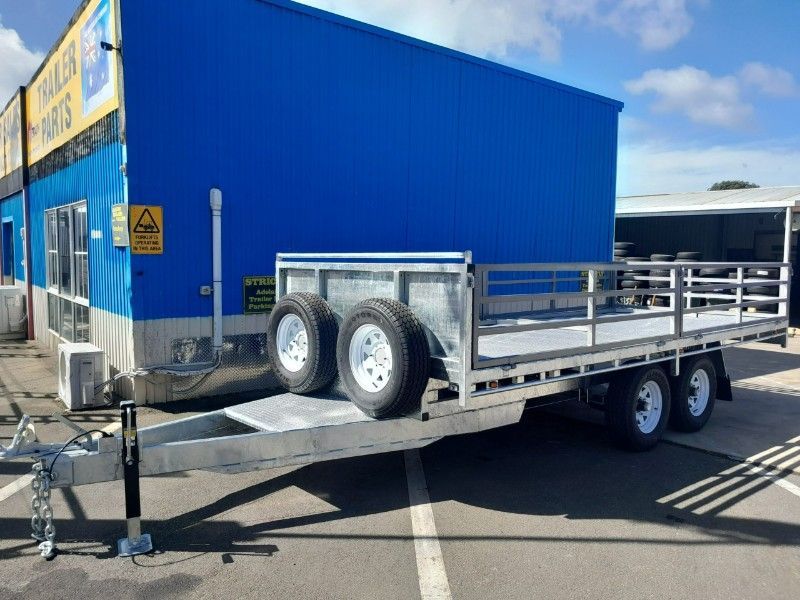A Trailer is Parked in Front of a Blue Building — Voyager Trailers in Nightcliff, NT