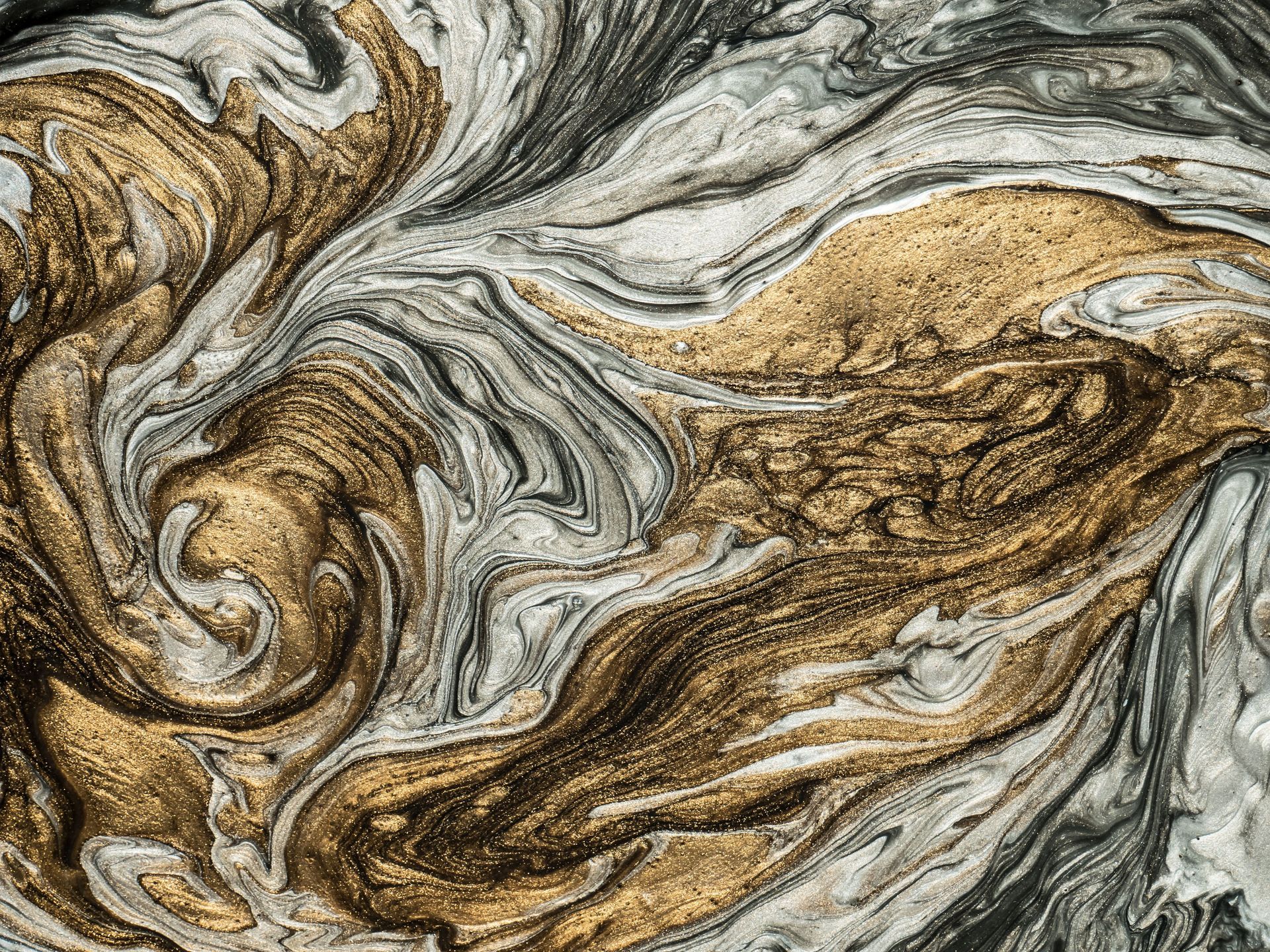 Gold and gray swirled metallic epoxy flooring finish