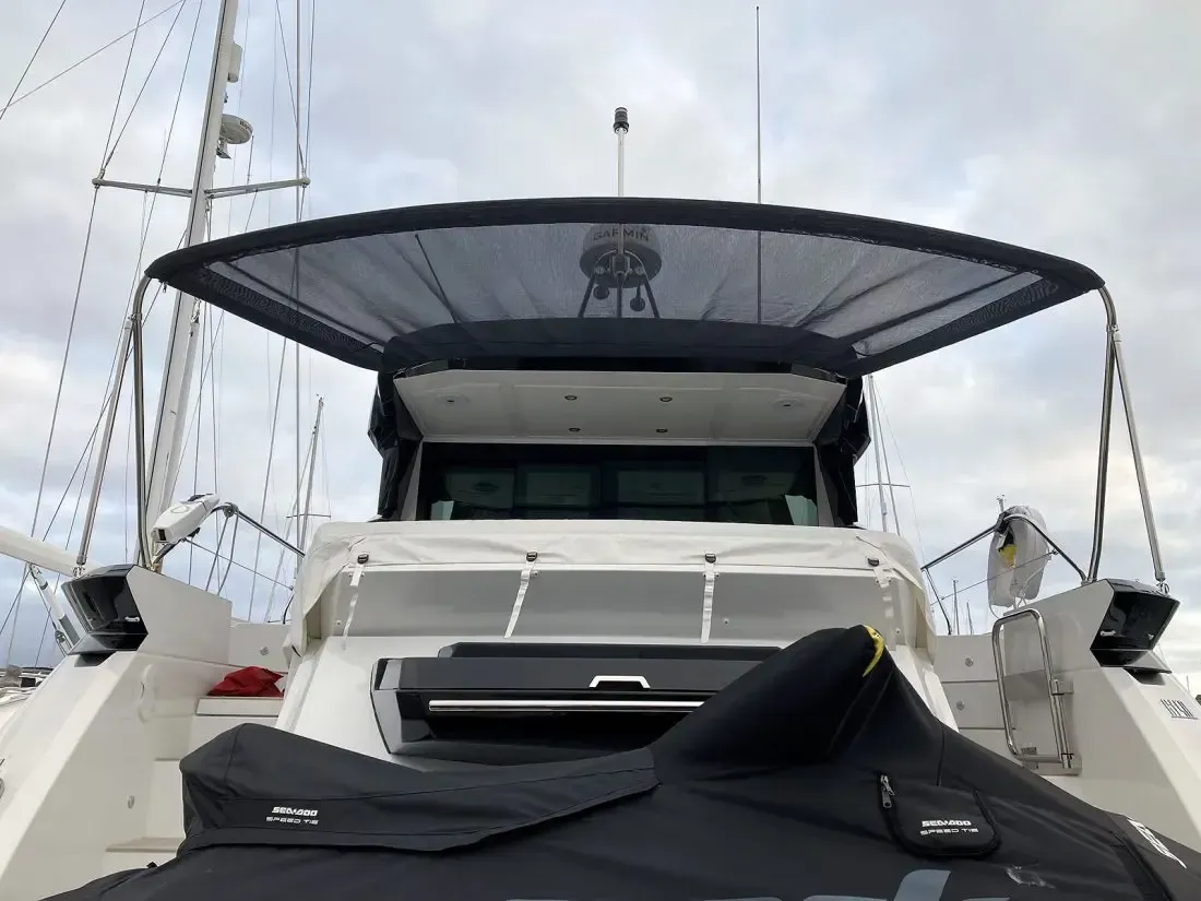 A boat with a jet ski on the back of it